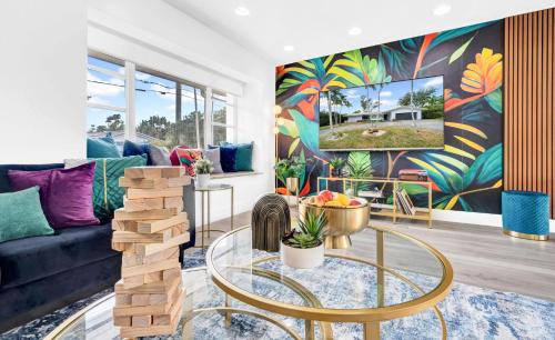 a living room with a couch and a table at Lakefront Retreat Perfect for Family Fun in Miami
