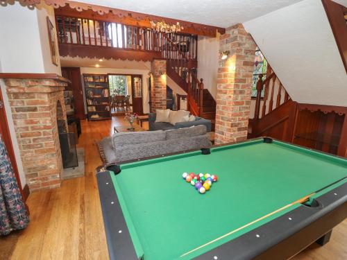 a pool table in the middle of a living room at The Chapel in Newport