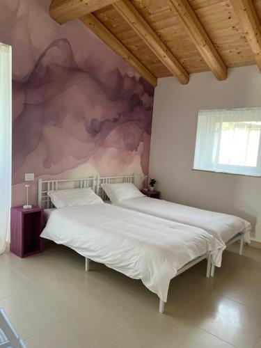 Una cama o camas en una habitación de Agriturismo Cascina Capo