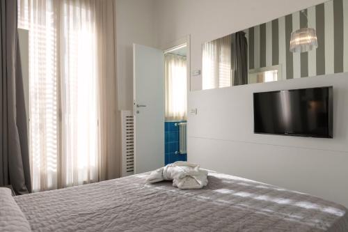 Perla Verde Hotelにあるベッド