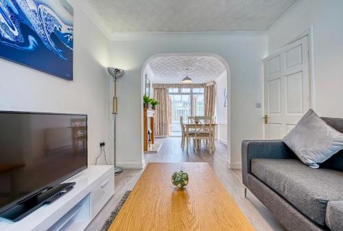 a living room with a couch and a table at Petsol Apartments in Birmingham