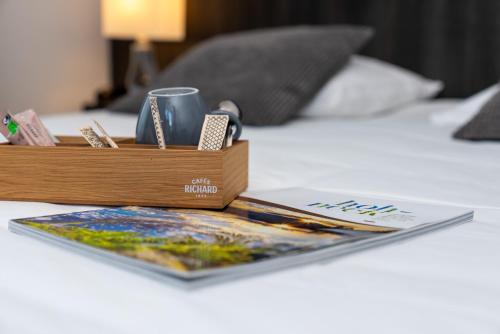 Ένα ή περισσότερα κρεβάτια σε δωμάτιο στο Hôtel La Réserve