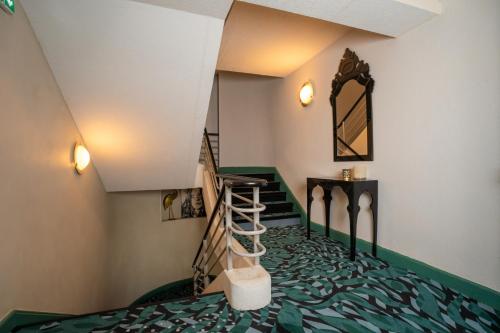 Ένα ή περισσότερα κρεβάτια σε δωμάτιο στο Hôtel La Réserve