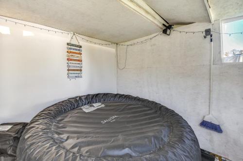 a mattress in a tent with a window at 1 Mi to Dtwn Remote Work-Friendly Apt in Hampton! in Hampton