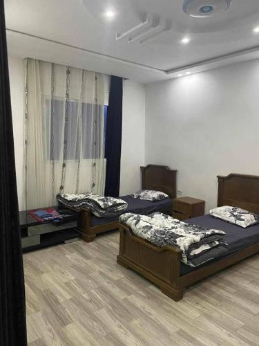 Ένα ή περισσότερα κρεβάτια σε δωμάτιο στο Appartement