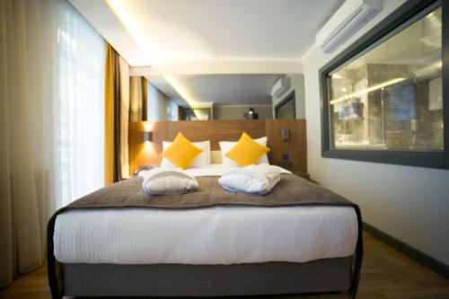 Una cama o camas en una habitación de Ankacity Suit Flat