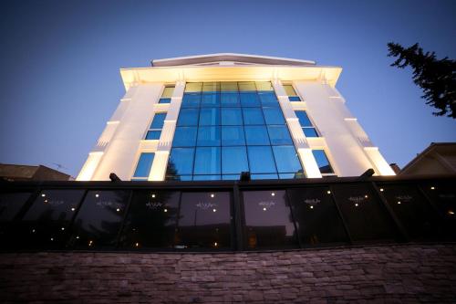 a tall building with a lot of windows at Ankacity Suit Flat in Ankara