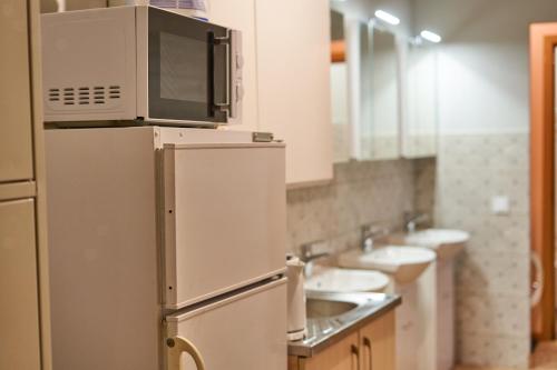 Kuchyň nebo kuchyňský kout v ubytování Tokyo Vibes - Private Sleeping Pods Hostel, Self check-in