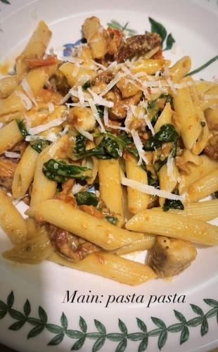 a plate of pasta with meat and vegetables at Kingsman in Katra