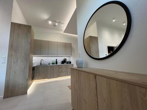 a kitchen with a large mirror on the wall at Goldhammer Premium Apartments in Tarnów