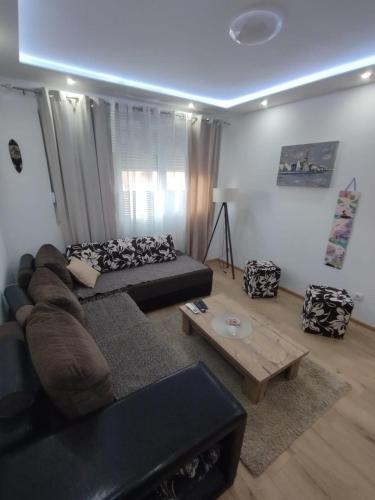 a living room with a couch and a coffee table at Centar Partenon in Smederevska Palanka