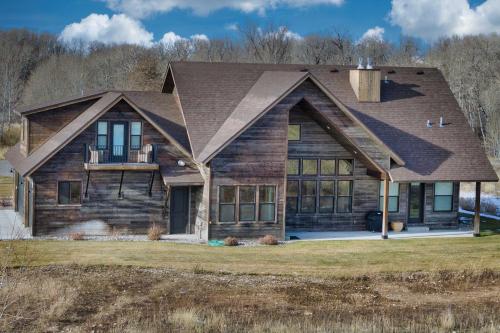 a wooden house with a gambrel roof at Luxe Tetonia Home with Tetons View, Close to Skiing! in Tetonia