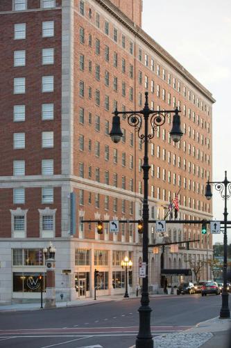 a large building with a street light in front of it at Renaissance Albany Hotel in Albany