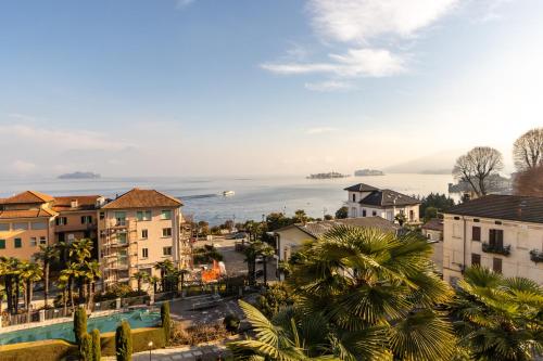a view of a city with the ocean in the background at Elm Alley Apartment - Baveno - Free Wi-Fi in Baveno
