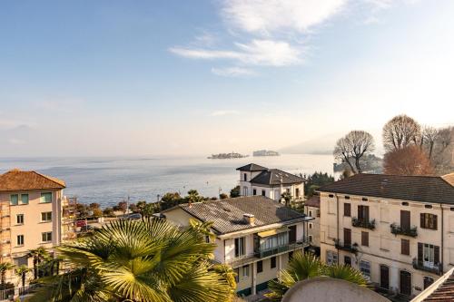 a city with houses and the ocean in the background at Elm Alley Apartment - Baveno - Free Wi-Fi in Baveno