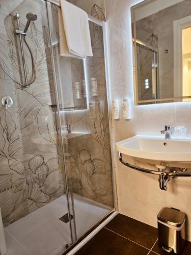 a bathroom with a shower and a sink at Ai Poeti in Brescia