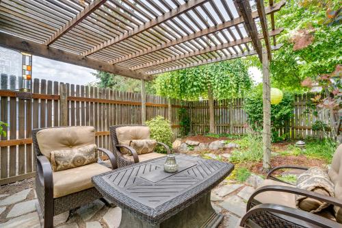 a patio with a table and chairs and a pergola at Wine Country Home with Yard Walk to Downtown! in Walla Walla