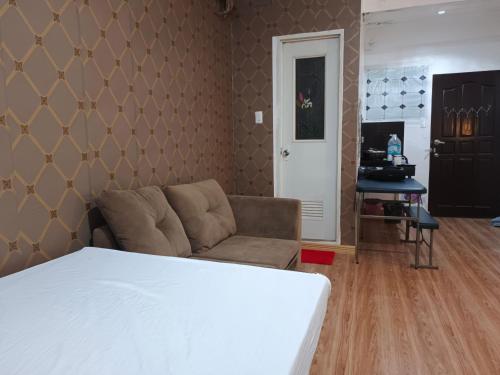 Ένα ή περισσότερα κρεβάτια σε δωμάτιο στο Montecarlo Townhouse Residences II