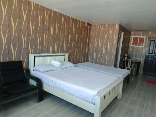 Ένα ή περισσότερα κρεβάτια σε δωμάτιο στο Montecarlo Townhouse Residences II