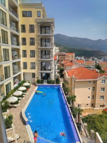 a swimming pool in the middle of a building at The Dream Getaway & Spa by DeVasco in Becici