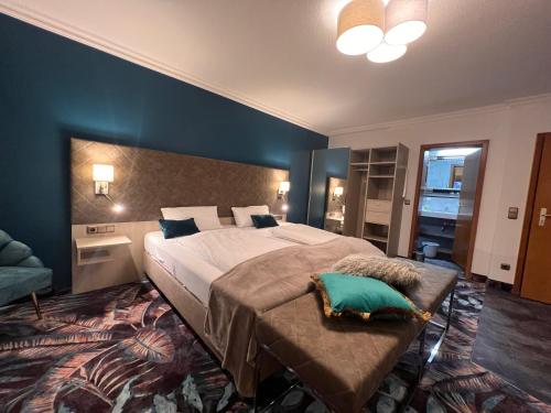 a bedroom with a large bed in a room at Appartementhotel Cura Bad Füssing in Bad Füssing