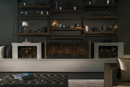 a living room with a couch and shelves at Renaissance Allentown Hotel in Allentown