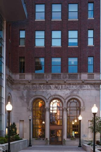 a large brick building with lights in front of it at Renaissance Allentown Hotel in Allentown