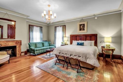 a bedroom with a bed and a living room at InnBuffalo Off Elmwood in Buffalo