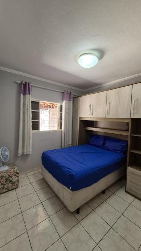 En eller flere senge i et værelse på Residencial Claudino Lopes