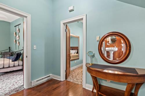 a bathroom with a sink and a mirror at The Pasfield House in Springfield