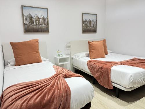 Una cama o camas en una habitación de Estancia Luciana