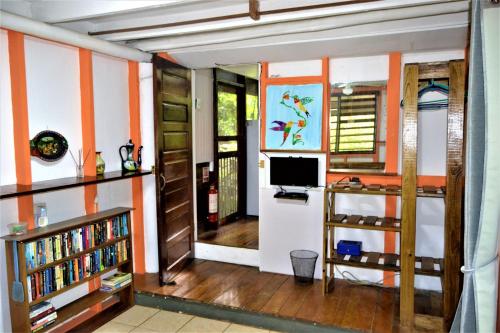 a living room with orange and white stripes at Jungle Like Oasis in San Ignacio - Secluded Cabaa Retreat Close To Mayan Ruins in San Ignacio