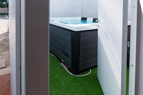 a bathroom with a sink and green grass at Villa Gianto pool & spa in Polignano a Mare