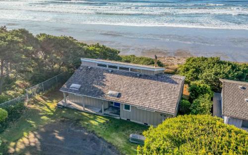 an aerial view of a house next to the ocean at Piot House in Seal Rock