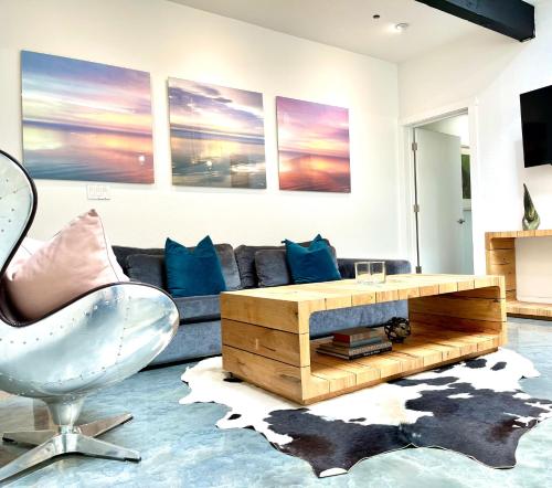 a living room with a couch and a table at Petaluma Warehouse Lofts Unit C in Petaluma