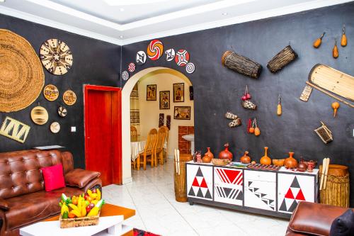 a living room with a couch and a table at Virunga Homestays in Ruhengeri