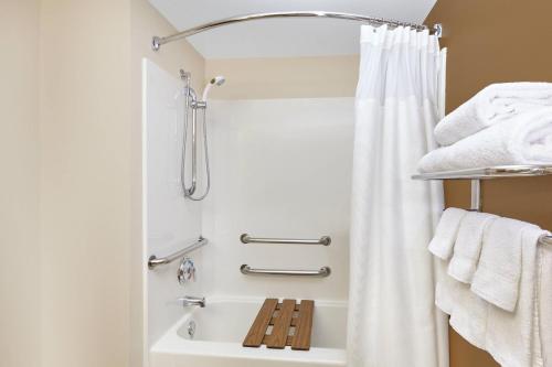 a bathroom with a shower with a shower curtain at Fairfield Inn and Suites Chicago Lombard in Lombard