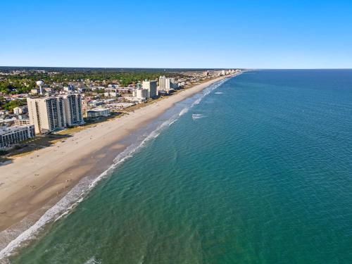 an aerial view of a beach with buildings and the ocean at Cozy Beachside Bungalow Studio Ideal for Couples in Myrtle Beach