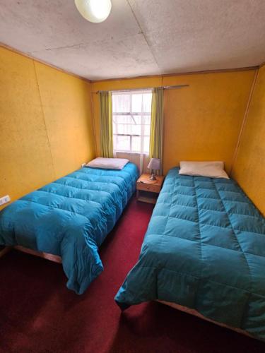 Ένα ή περισσότερα κρεβάτια σε δωμάτιο στο Catema