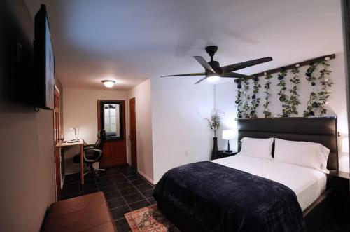 a bedroom with a bed and a ceiling fan at City Gem in Long Island City