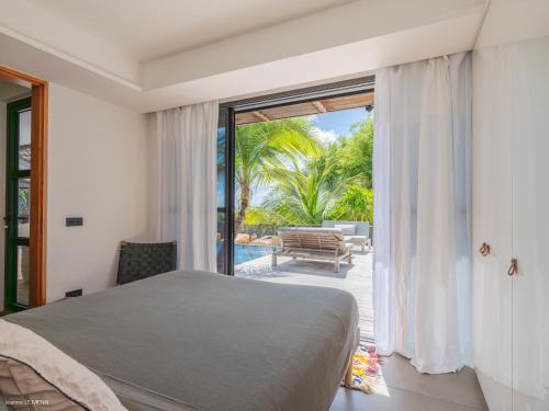 Ένα ή περισσότερα κρεβάτια σε δωμάτιο στο Villa GYPSET Gouverneur