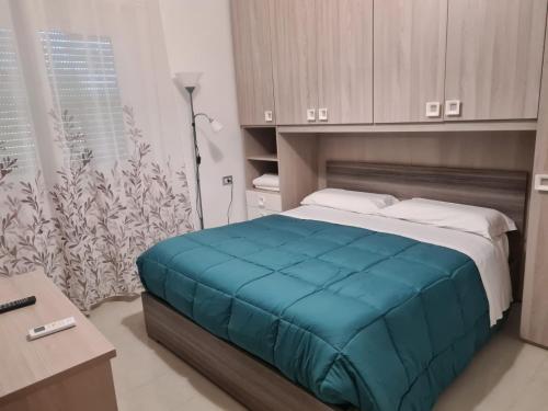 A bed or beds in a room at Lido Venere Affittacamere
