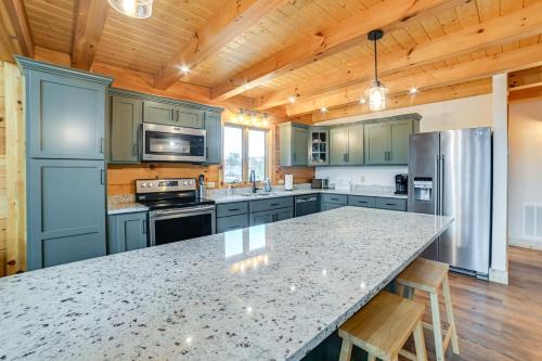 a kitchen with a large counter top in a house at Large Deck and Shared Dock Cabin on Kentucky Lake! in Gilbertsville