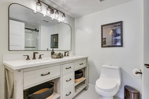 a bathroom with a sink and a toilet and a mirror at Close to Beaver Creek and Vail Cozy Edwards Condo! in Edwards