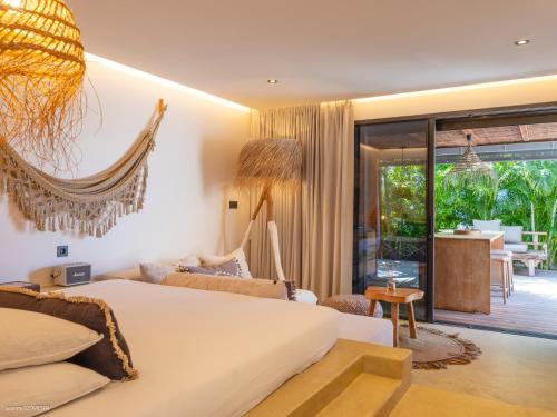 Postel nebo postele na pokoji v ubytování Le Bungalow Gypset