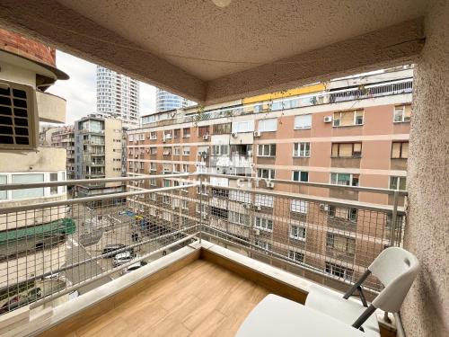 a balcony with a view of a building at WATEREFRONT Apartments - Belgrade in Belgrade