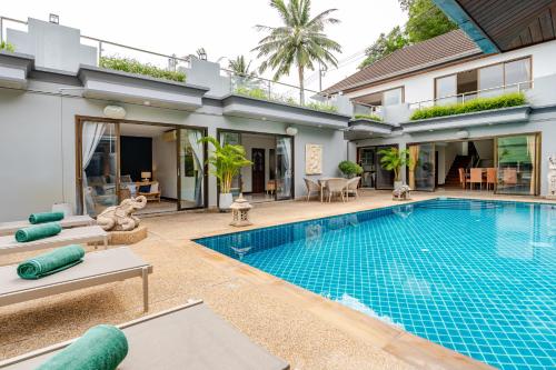 an image of a swimming pool in a villa at Luxury 4BR Villa with Pool & Ocean Views on Patong in Patong Beach