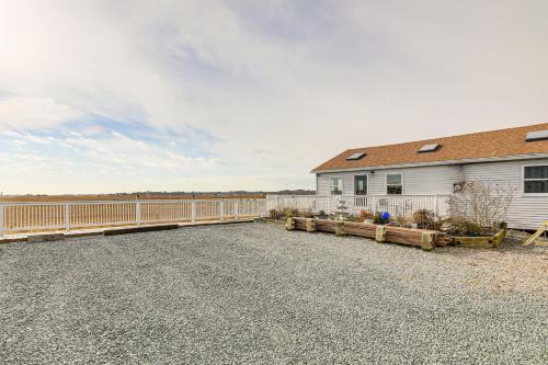 a driveway with a fence and a house at Walk to Beach Water-View Seabrook Sanctuary in Seabrook