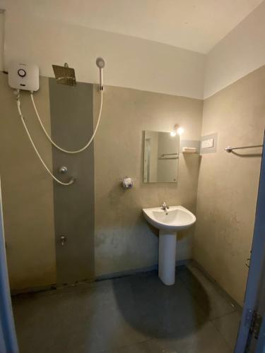 a bathroom with a sink and a mirror at BE MY Guest in Mirissa