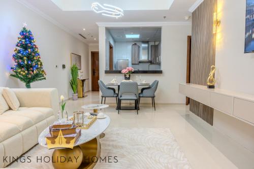 a living room with a christmas tree in it at Luxury 2 Apartments Dunya tower Burj Khalifa St in Dubai